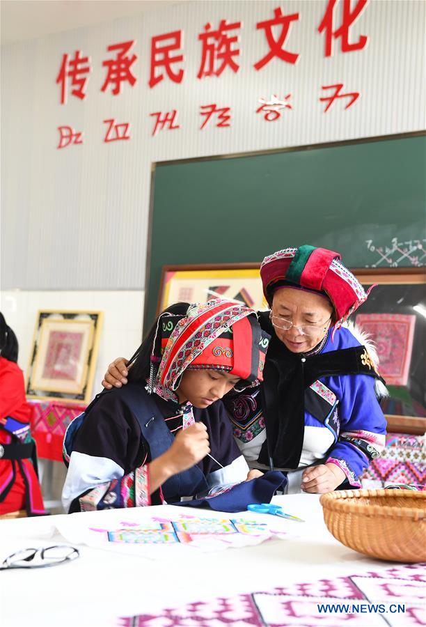 CHINA-YUNNAN-SHILIN-YI EMBROIDERY-INHERITOR (CN)